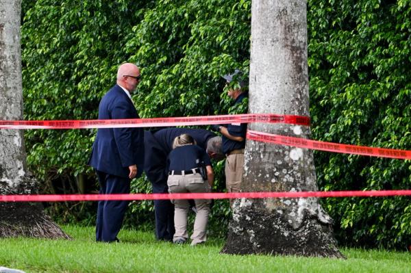 Law enforcement officials at the crime scene wher<em></em>e Routh was positio<em></em>ned on the edge of Trump's West Palm Beach golf course.