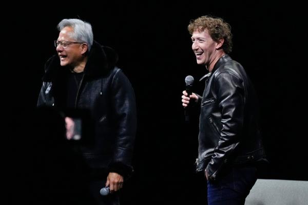 Nvidia CEO Jensen Huang laughing with me<em></em>ta CEO Mark Zuckerberg on stage at SIGGRAPH 2024 after exchanging jackets