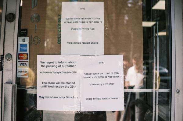 Sign on a window of Gottlieb's famed Jewish deli in Brooklyn announcing closure due to the owner's death