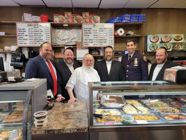 Shalom Gottlieb, third left, owner of Gottleb's Restaurant and Delicatessen in Brooklyn is seen in an undated photo obtained by the Post. 