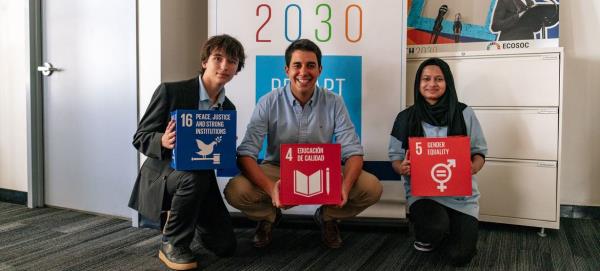 UN Assistant Secretary-General for Youth Affairs Felipe Paullier (centre) meets New York City school students Fariha Akter (right) and Erik Ponomarev.