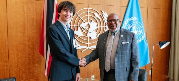 General Assembly President Dennis Francis (right) and New York City school student Erik Ponomarev.