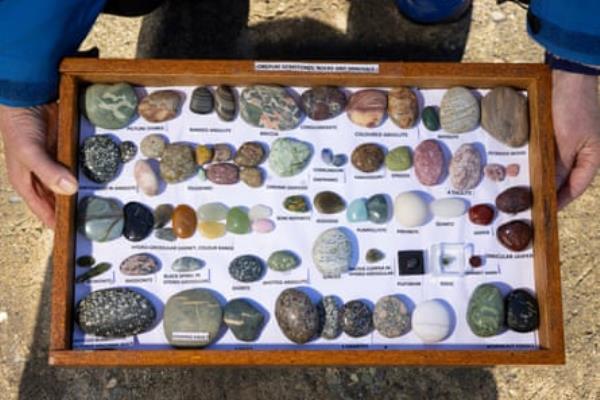 Invercargill rock collector Marion Troon has been fossicking at Gemstone Beach since the mid-’90s. Here she shows a board presenting the variety of precious sto<em></em>nes that she sourced from the beach.