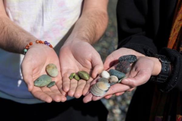 Tourist fossickers James Bergmann, of Canada, (left) and Raz Rothschild, of Israel, (right) compare precious sto<em></em>nes at Gemstone Beach.