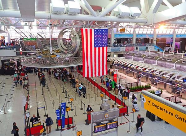 View of a giant American flag inside Terminal 1 at JFK Airport