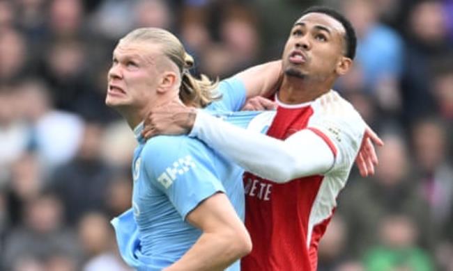 Gabriel gets to grips with Haaland during the goalless draw at the Eithad Stadium towards the end of last season.