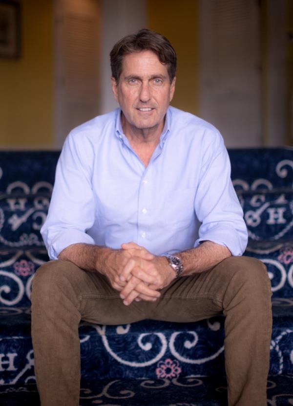 Curtis Bashaw, Republican candidate for New Jersey Senate, sitting on a blue couch in the Brown Room of the Co<em></em>ngress Hall hotel he owns in Cape May, NJ