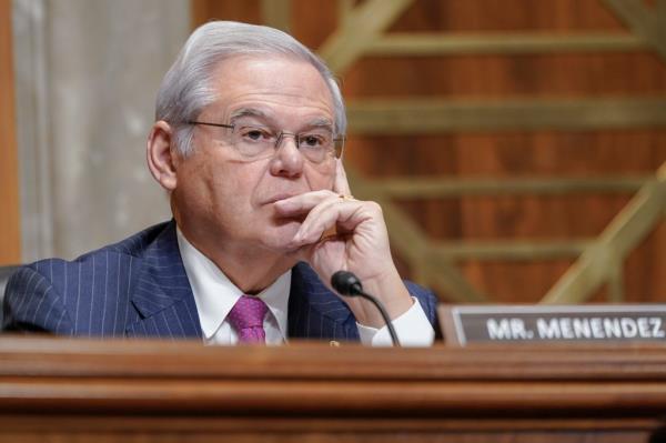 Senator Bob Menendez in a suit and tie, listening attentively during a Senate Foreign Relations Committee meeting in Washington on December 7, 2023.