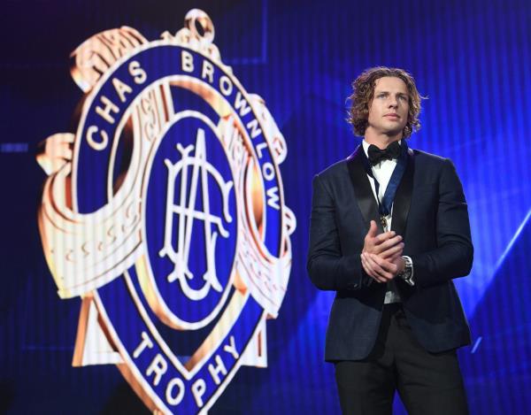 Nat Fyfe stands on stage after winning the 2019 Brownlow Medal