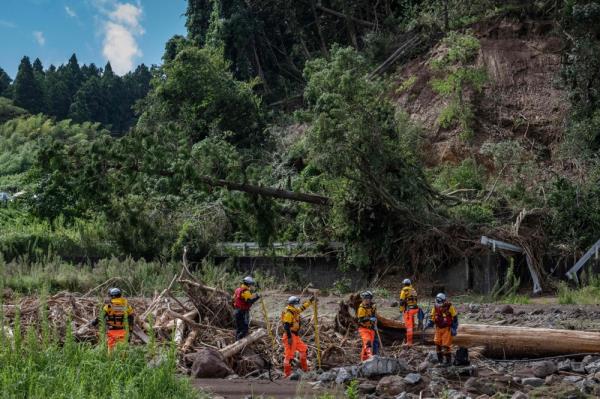 Rescue perso<em></em>nnel search for missing people along the Tsukada river after houses were swept away by raging floodwaters following heavy rain in Wajima city, Ishikawa prefecture on September 23, 2024. — AFP pic