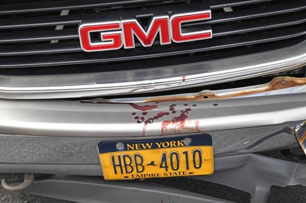 Blood on a car at the scene of the slashings.