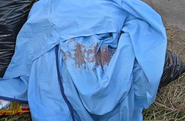 A victim's blood on a tarp near the scene of the fight.