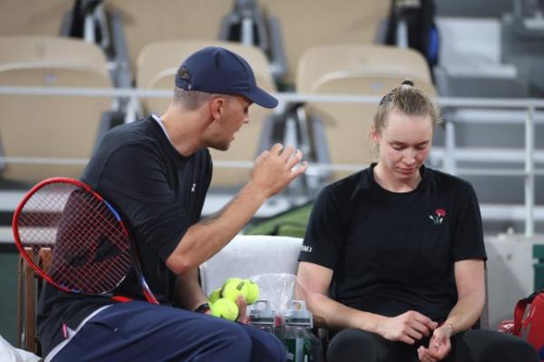 Coach Stefano Vukov is pictured shouting at tennis player Elena Rybakina