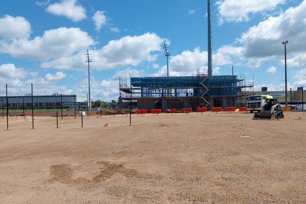 Co<em></em>nstruction site with steel f<em></em>ramework of new clubhouse building in the background.