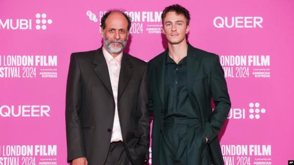 Director Luca Guadagnino, left, and actor Drew Starkey pose for photographers upon arrival at the premiere for the film "Queer" during the Lo<em></em>ndon Film Festival, Oct. 17, 2024, in London. (Scott A. Garfitt/Invision/AP)