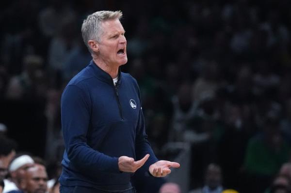 Warriors head coach Steve Kerr calls to his players during the first half of an NBA basketball game against the Boston Celtics