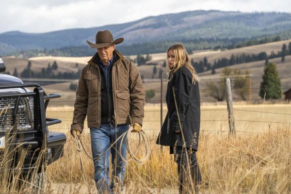 Kevin Costner and Piper Perabo on "Yellowstone," with a nice truck. 