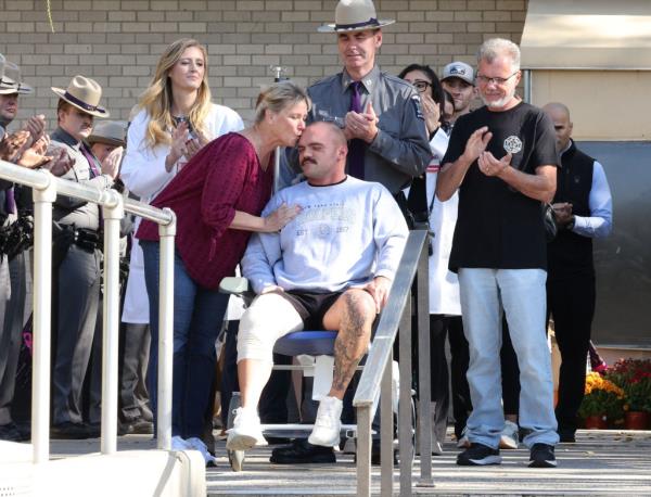 NY State Trooper Thomas Mascia seen leaving the Nassau University Medical Center.