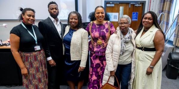 Professor Lisa-Dio<em></em>nne Morris with friends & family and the Lord Mayor stood in a group smiling at the camera.