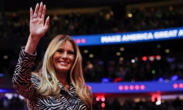 Melania Trump waves to supporters in a stadium