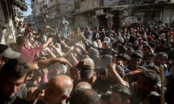 Thousands of displaced people crowd in front of bakeries in Khan Younis, southern Gaza