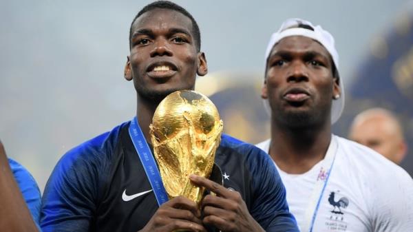 Paul Pogba (L) pictured with brother Matthias after winning the World Cup in 2018