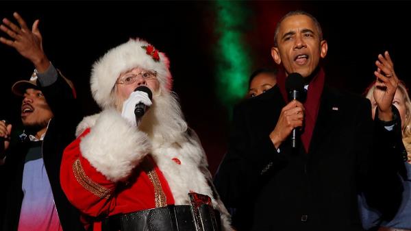 Barack Obama singing with Santa Claus