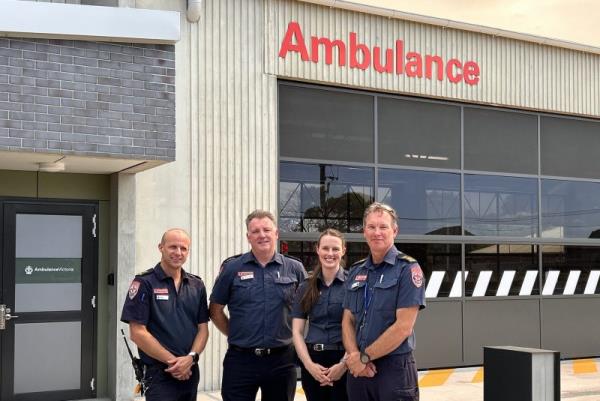 A group of paramedics outside an ambulance branch.