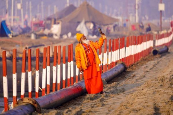 A sadhu or a Hindu holy man, takes his selfie near Sangam, the co<em></em>nfluence of Ganges, Yamuna and mythical Saraswati rivers, ahead of the Maha Kumbh Mela festival in Prayagraj on December 22, 2024. — AFP pic