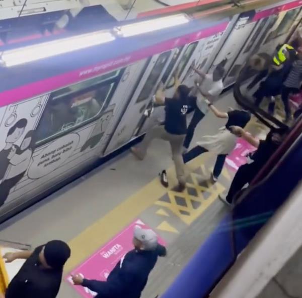 A screen shot of a video showing the brawl involving football fans at the Bandar Tasik Selatan LRT Station on the Ampang-Sri Petaling Line.