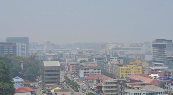 An aerial view of Kota Kinabalu shows the city shrouded in a thick haze on April 4, 2016. Sabah Progressive Party reaffirms its unwavering stance on safeguarding Sabah’s political autonomy. — Bernama pic