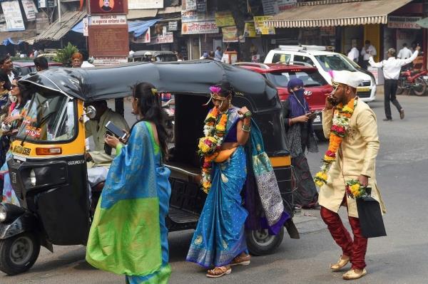 File photo of an Indian bride and groom arriving at a marriage hall. India is home to more than 220 million child brides, according to the United Nations, but the number of child weddings has fallen dramatically this century. -— AFP