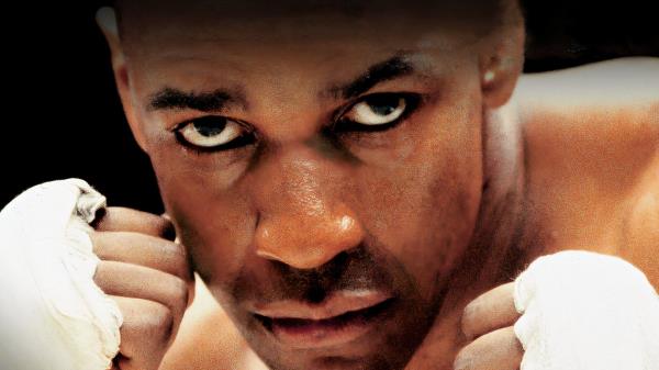 Denzel Washington with raised fists as a boxer in the 1999 movie The Hurricane