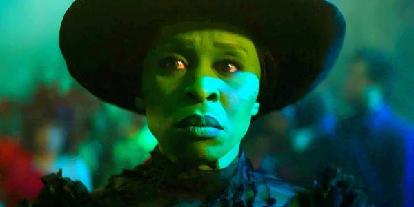 Cynthia Erivo as Elphaba walking through the Ozdust Ballroom in Wicked