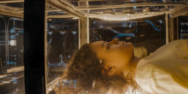 Lila (Chloe Lea) in a glass bed with spice that will rejuvenate Lila's mind in Dune: Prophecy Season 1 Ep 3