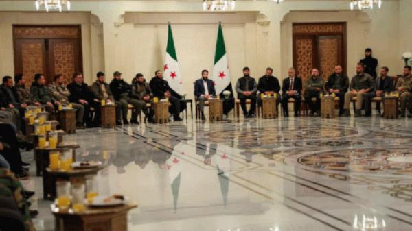 Syria&#039;s de facto leader Ahmed al-Sharaa attends a meeting with former rebel faction chiefs, as he reached an agreement with them to dissolve all groups and co<em></em>nsolidate them under the Defence Ministry, according to a statement from the new administration, in Damascus, Syria, in this handout image released on 24 December 2024. Photo: Reuters