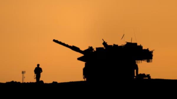 The silhouettes of a military vehicle and a soldier are seen near the Gaza border, amid the o<em></em>ngoing co<em></em>nflict in Gaza between Israel and Hamas, in Israel, 16 December 2024. Photo: Reuters