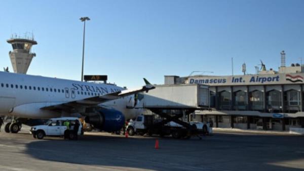 Ground perso<em></em>nnel prepare a Syrian Air aircraft before a flight to the city of Aleppo on December 18, 2024, at Damascus internatio<em></em>nal airport. Photo: AFP